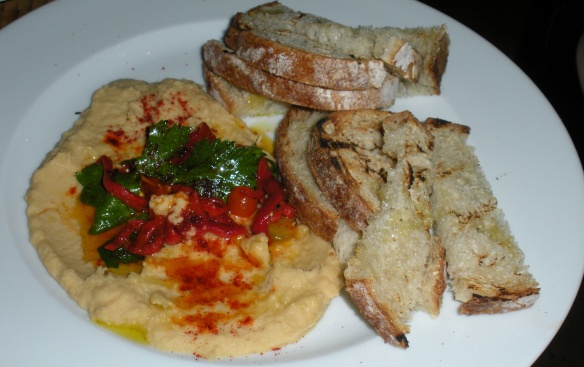 Warm hummus with grilled bread